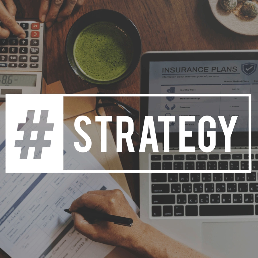 laptop with the word strategy written over it